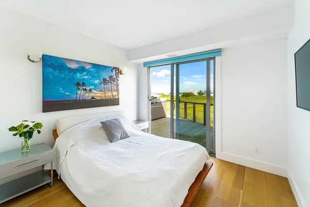 a bathroom with a tub a sink and a shower