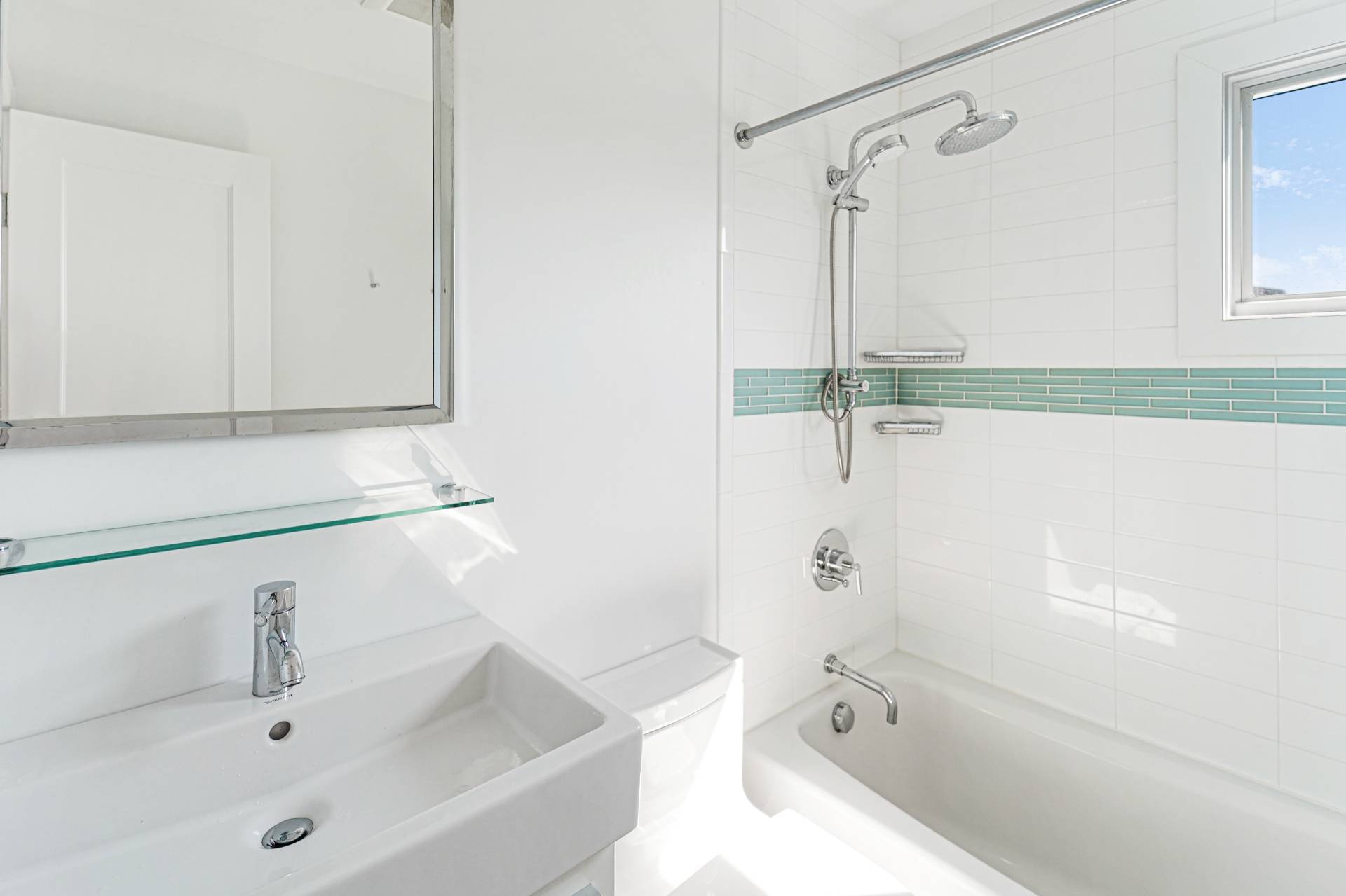 548 Dune Road Westhampton, NY 11978 - Photo 18 of 34 a bathroom with a tub a sink and a shower