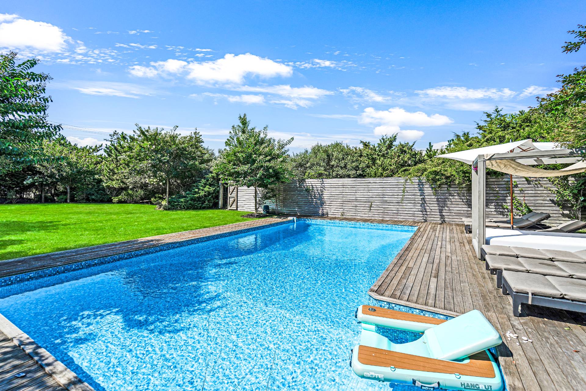 548 Dune Road Westhampton, NY 11978 - Photo 24 of 34 a view of outdoor space swimming pool and outdoor seating