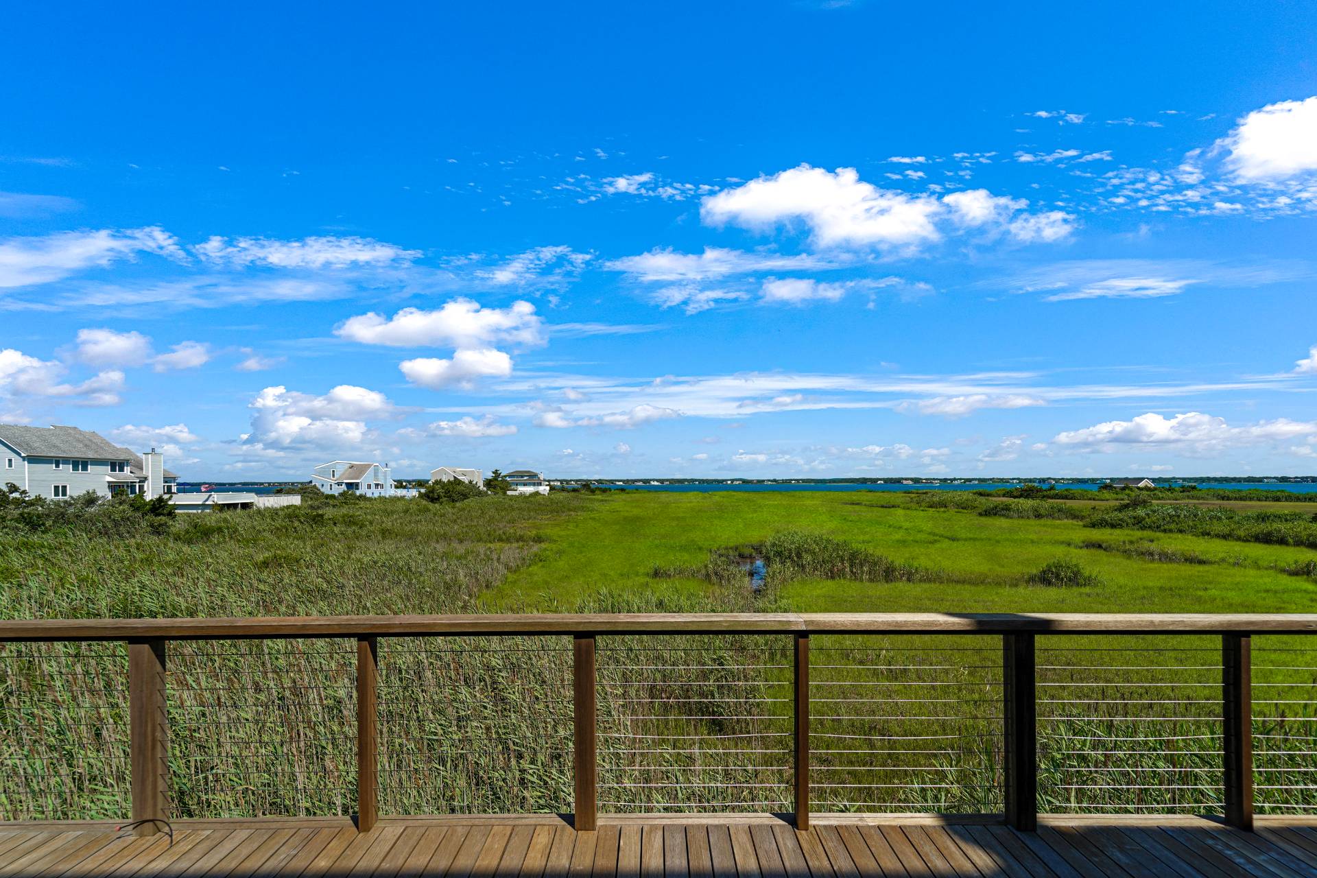 548 Dune Road Westhampton, NY 11978 - Photo 29 of 34 a view of a balcony with an ocean beach