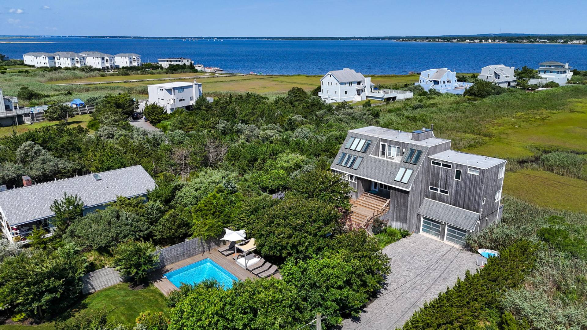 548 Dune Road Westhampton, NY 11978 - Photo 3 of 34 an aerial view of a house with a garden