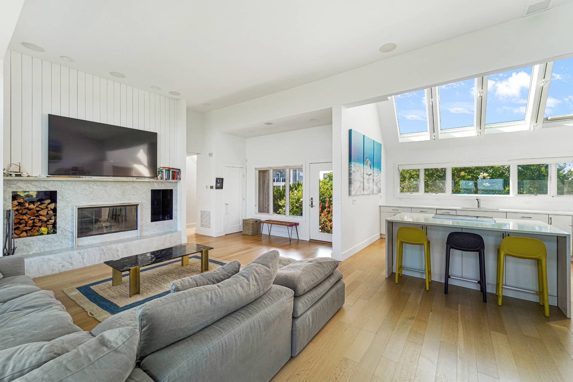 548 Dune Road Westhampton, NY 11978 - Photo 6 of 34 a living room with furniture and a flat screen tv