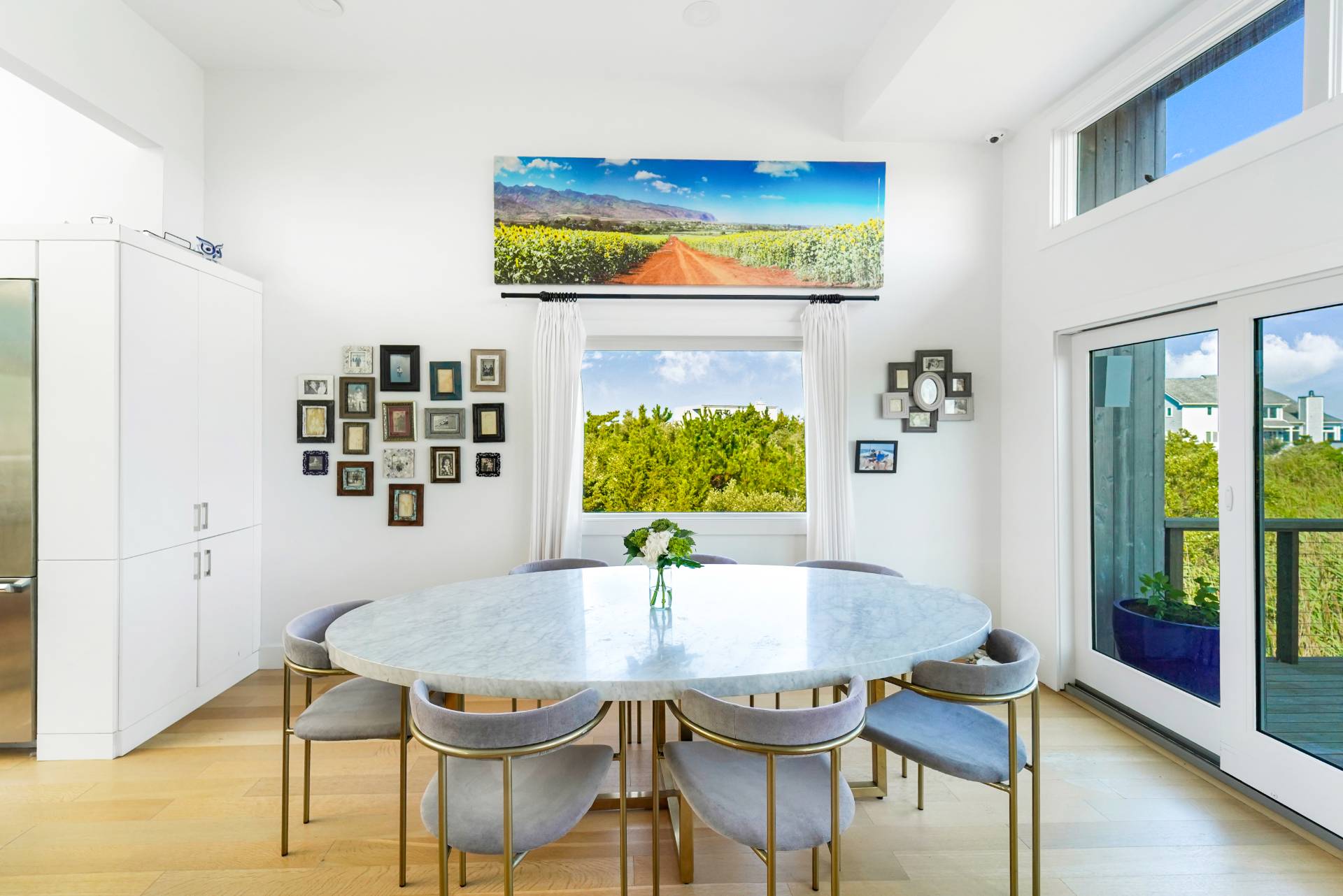 548 Dune Road Westhampton, NY 11978 - Photo 8 of 34 a view of a dining room with furniture and a window