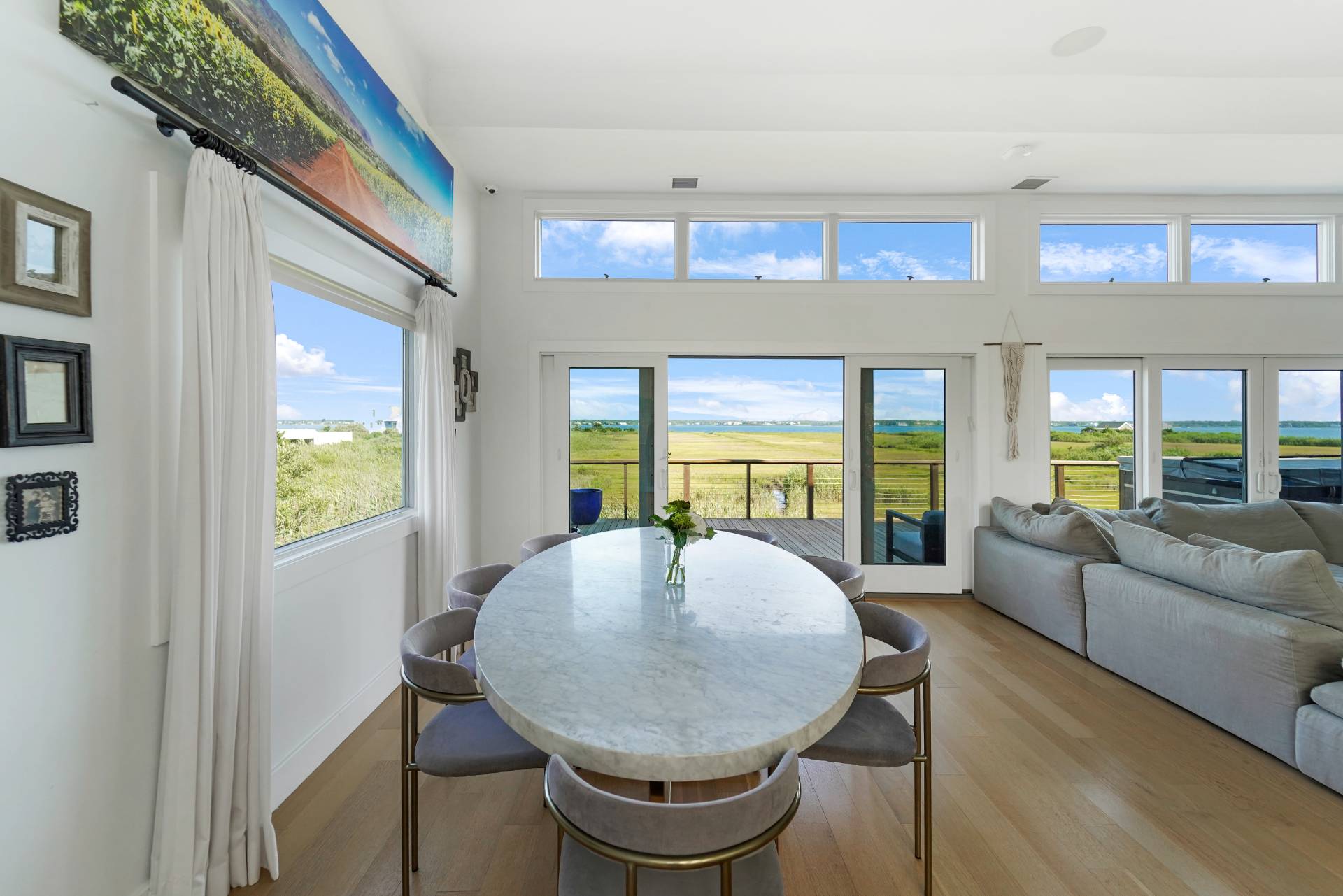 548 Dune Road Westhampton, NY 11978 - Photo 9 of 34 a view of a dining room with furniture window and outside view