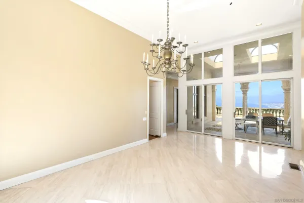 a view of a room with large windows