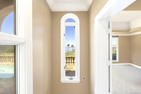 a view of an entryway with wooden floor