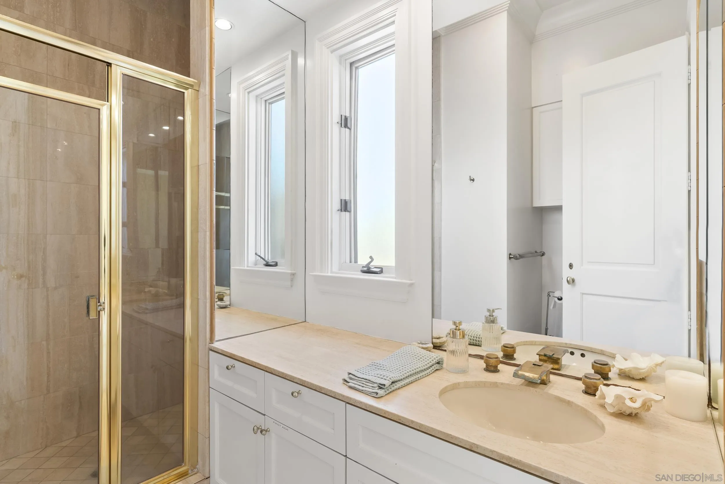 2302 Rue Adriane La Jolla, CA 92037 - Photo 28 of 31 a bathroom with a sink and a mirror