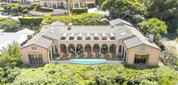 a large kitchen with stainless steel appliances granite countertop a lot of counter space and wooden floor