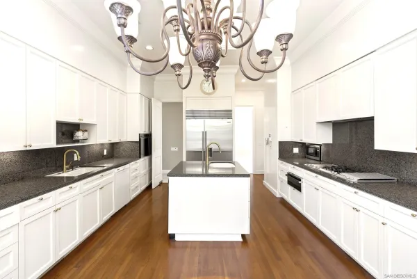 a kitchen with a large window and a sink