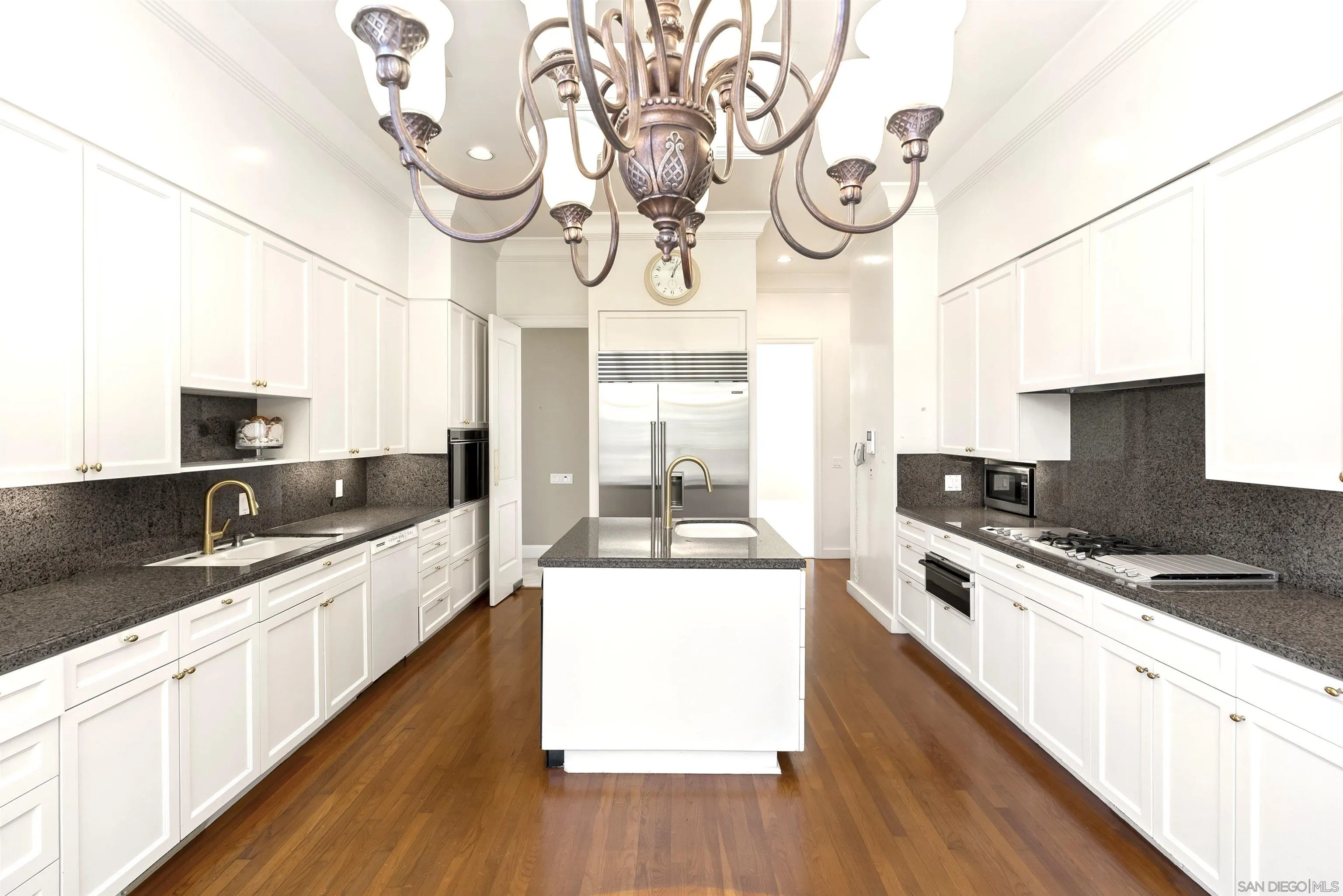 2302 Rue Adriane La Jolla, CA 92037 - Photo 9 of 31 a large kitchen with stainless steel appliances granite countertop a lot of counter space and wooden floor