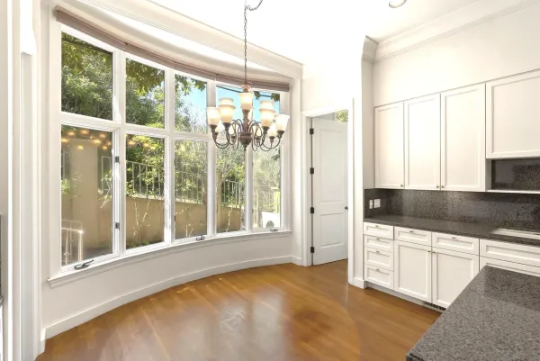 a utility room with cabinets washer and dryer