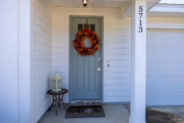 a view of entryway with a wooden door