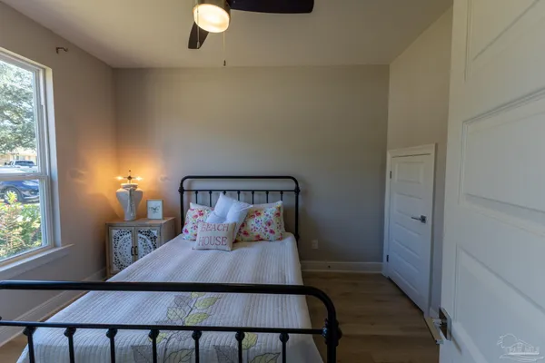 a bedroom with a bed and window