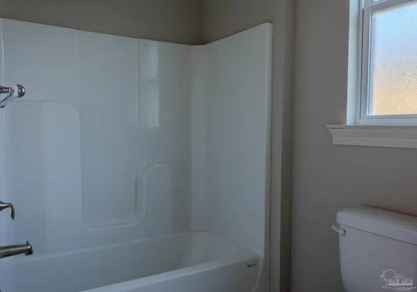 a close up of a bathtub with a window