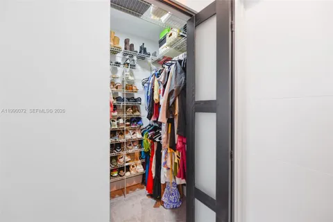 a bathroom with a double vanity sink mirror and toilet