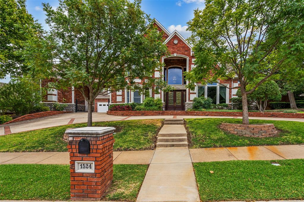 1524 Hunters Ridge Circle Denton, TX 76205 - Photo 1 of 1 a front view of a house with a yard