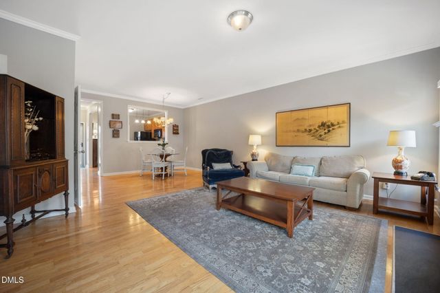 a view of a patio with table and chairs and potted plants