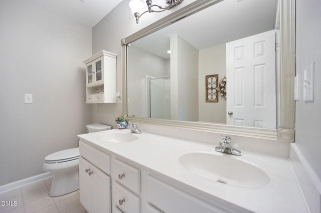 an aerial view of a houses with a street