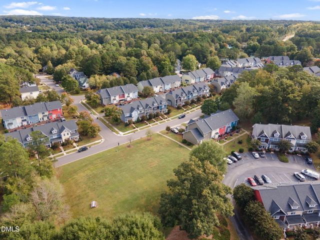 a front view of a house with garden and porch