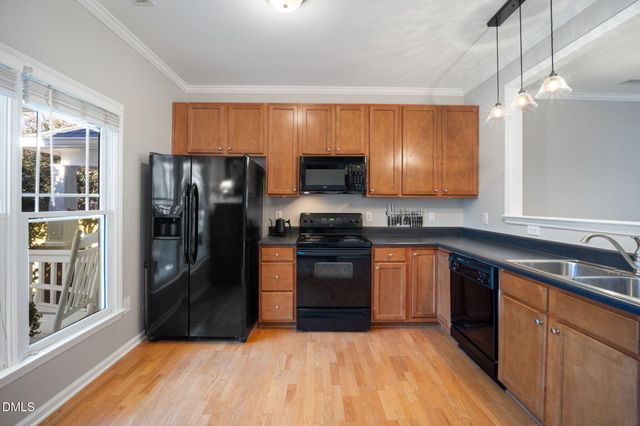 a kitchen with a stove and a sink
