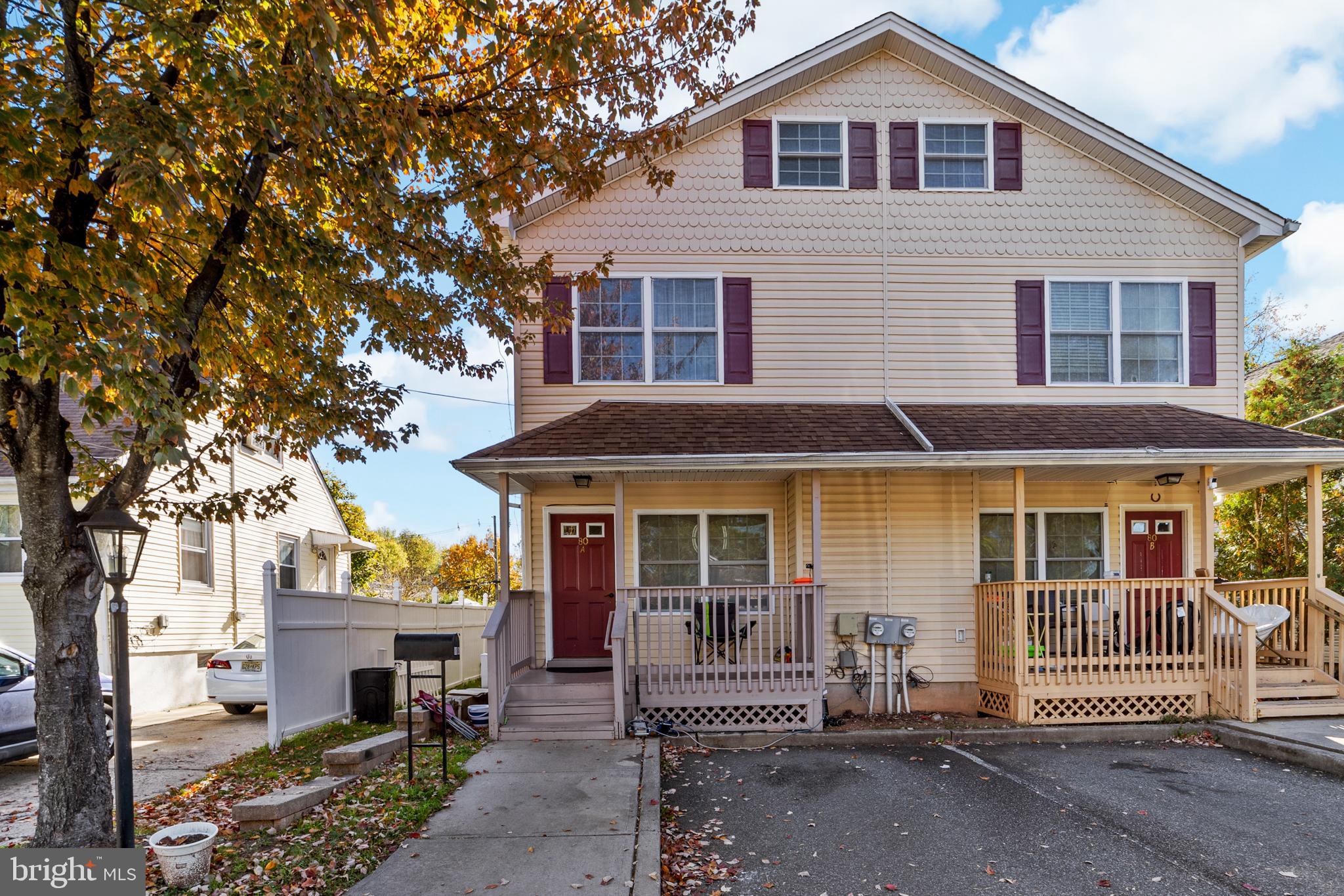 80 Larch Avenue New Brunswick, NJ 08901 - Photo 2 of 24 a front view of a house with a tree