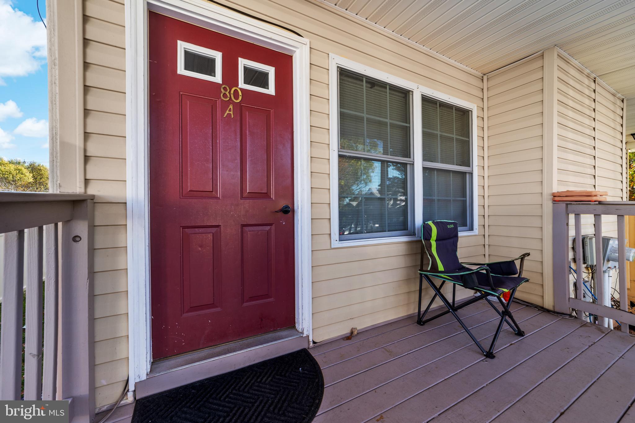 80 Larch Avenue New Brunswick, NJ 08901 - Photo 4 of 24 a view of a house with a chairs and table in a patio