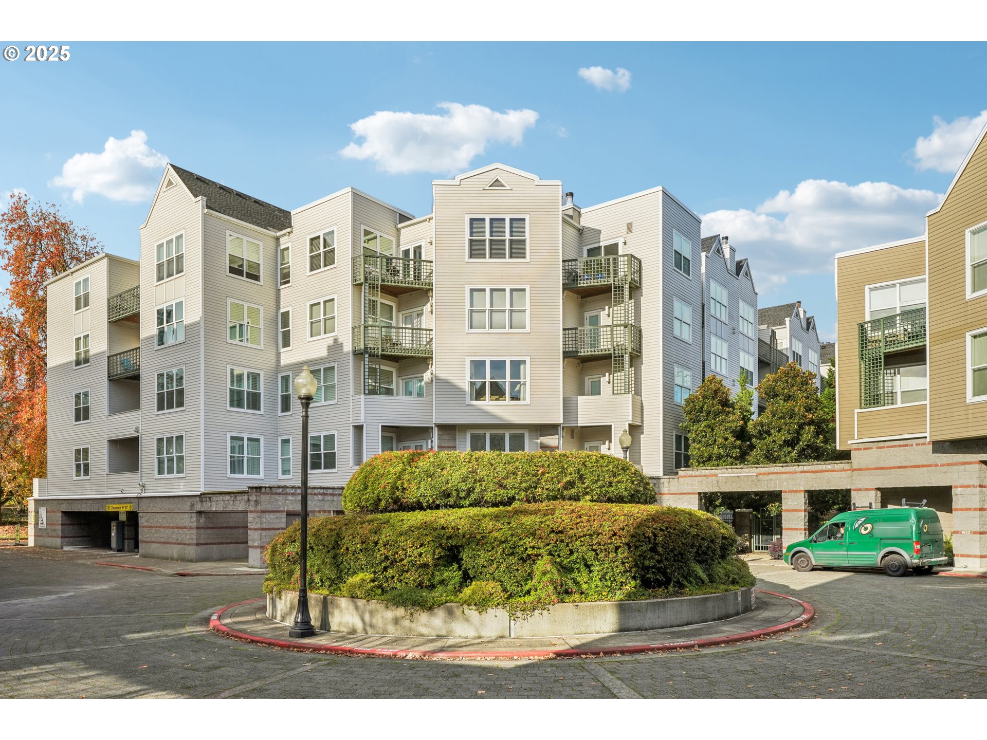 1616 South Harbor Way, Unit 402 Portland, OR 97201 - Photo 1 of 34 a front view of a building with a garden