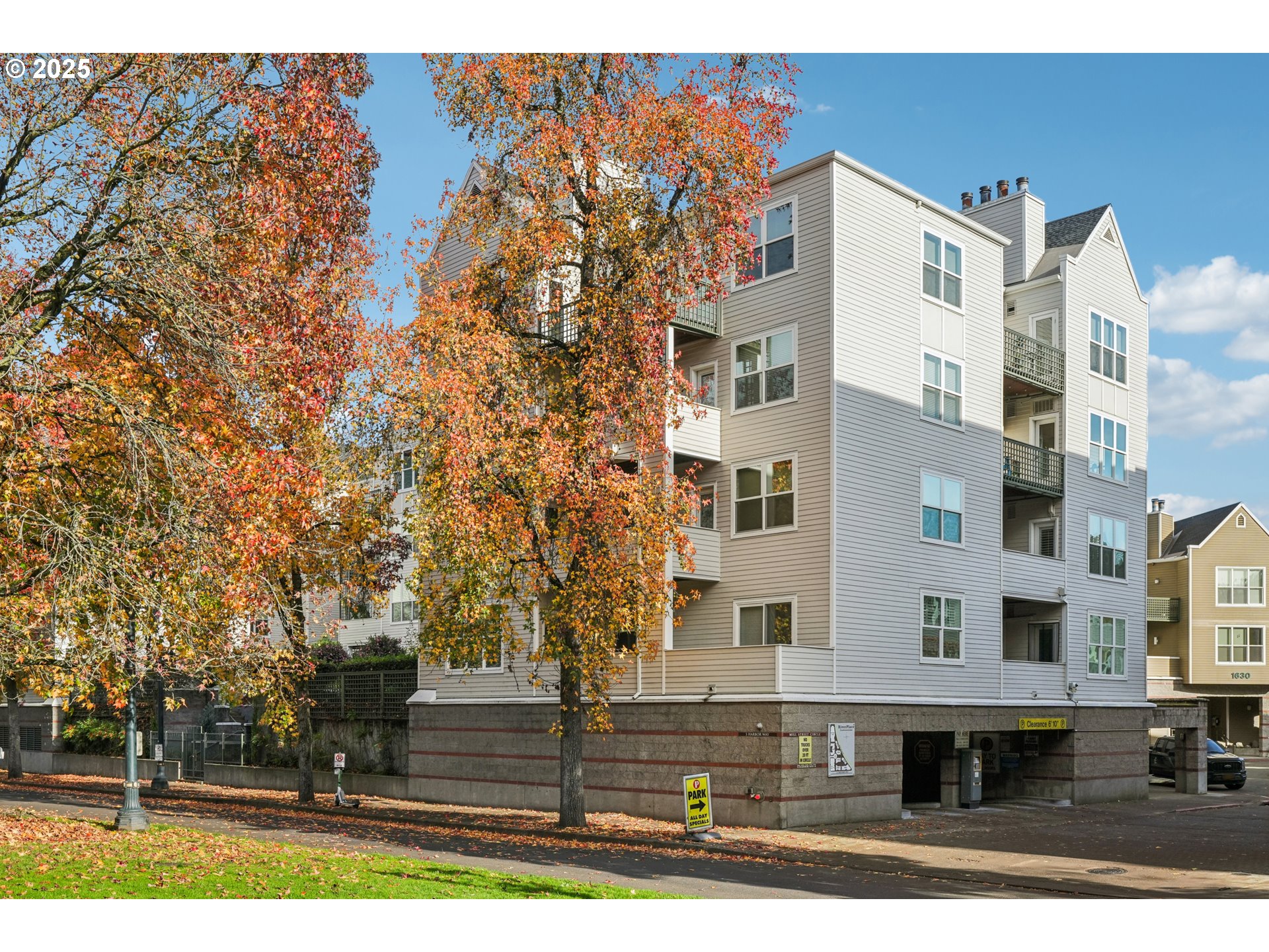 1616 South Harbor Way, Unit 402 Portland, OR 97201 - Photo 3 of 34 a front view of a building with trees