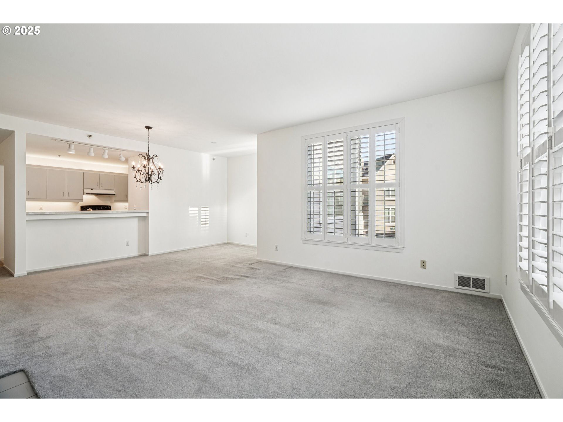 1616 South Harbor Way, Unit 402 Portland, OR 97201 - Photo 6 of 34 a view of an empty room with a kitchen