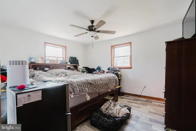 a bed room with a bed and a window