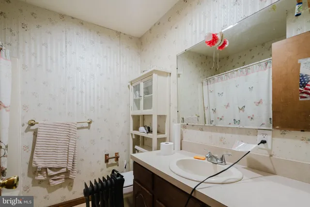 a view of a workspace with furniture and entryway