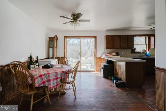 a view of a dining room with furniture and window
