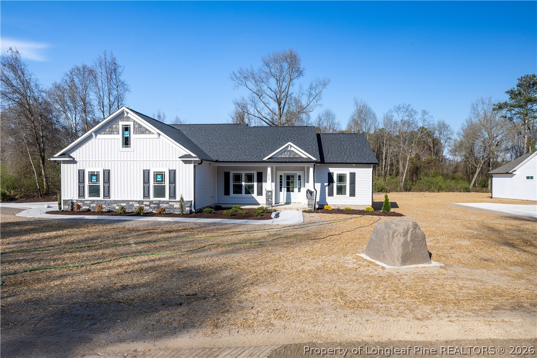 1808 Alderman Mill Road Dunn, NC 28334 - Photo 1 of 13 a front view of a house with a yard
