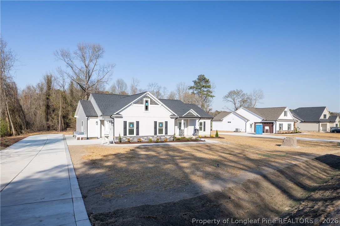 1808 Alderman Mill Road Dunn, NC 28334 - Photo 2 of 13 a front view of a house with a yard
