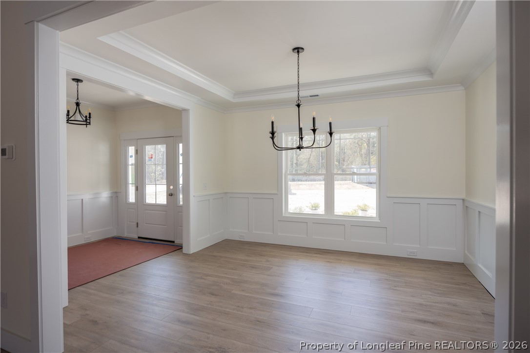 1808 Alderman Mill Road Dunn, NC 28334 - Photo 4 of 13 a view of empty room with wooden floor and window