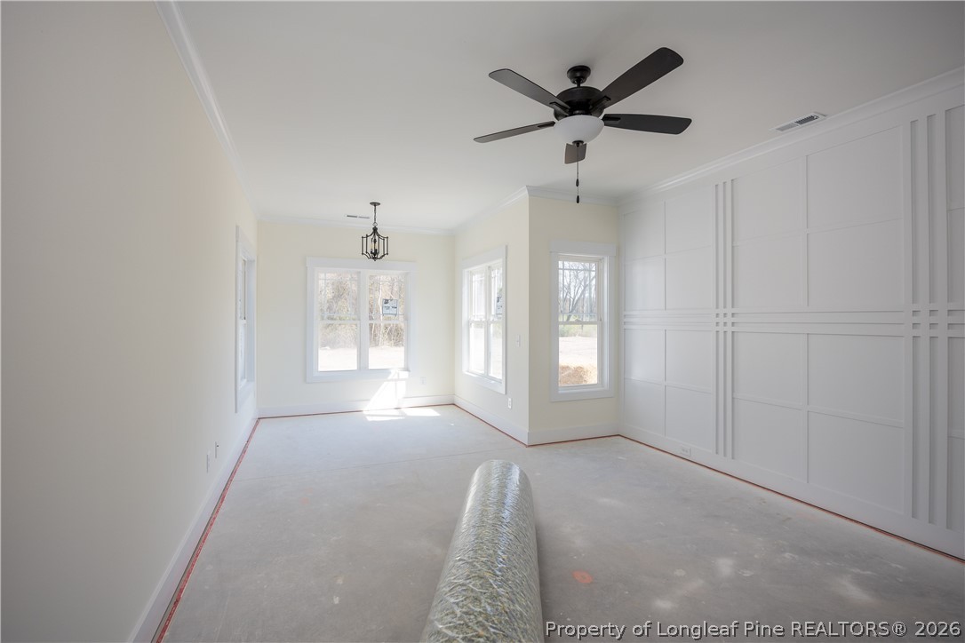 1808 Alderman Mill Road Dunn, NC 28334 - Photo 10 of 13 a view of an empty room with a ceiling fan