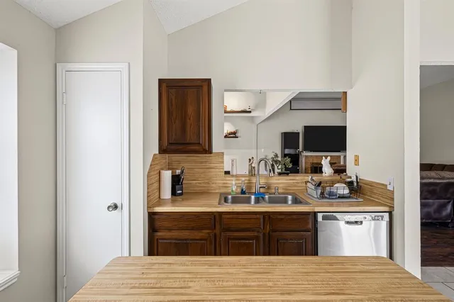 a kitchen with a refrigerator stove and sink