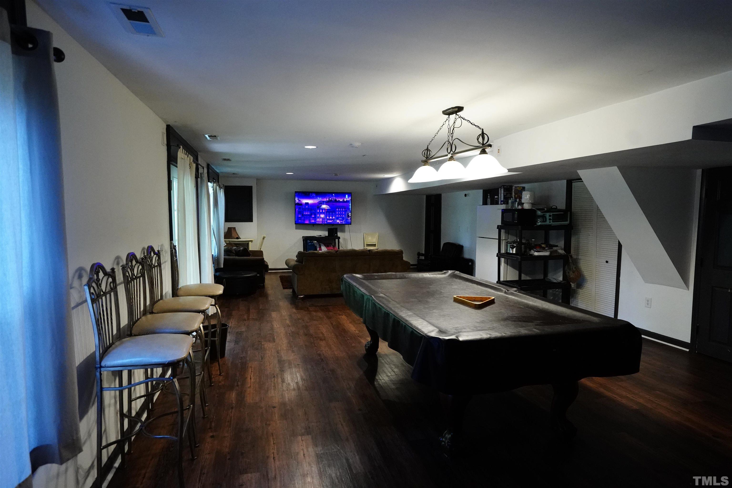 1212 Cranmoore Court Raleigh, NC 27604 - Photo 12 of 14 a view of a dining room with furniture window and wooden floor