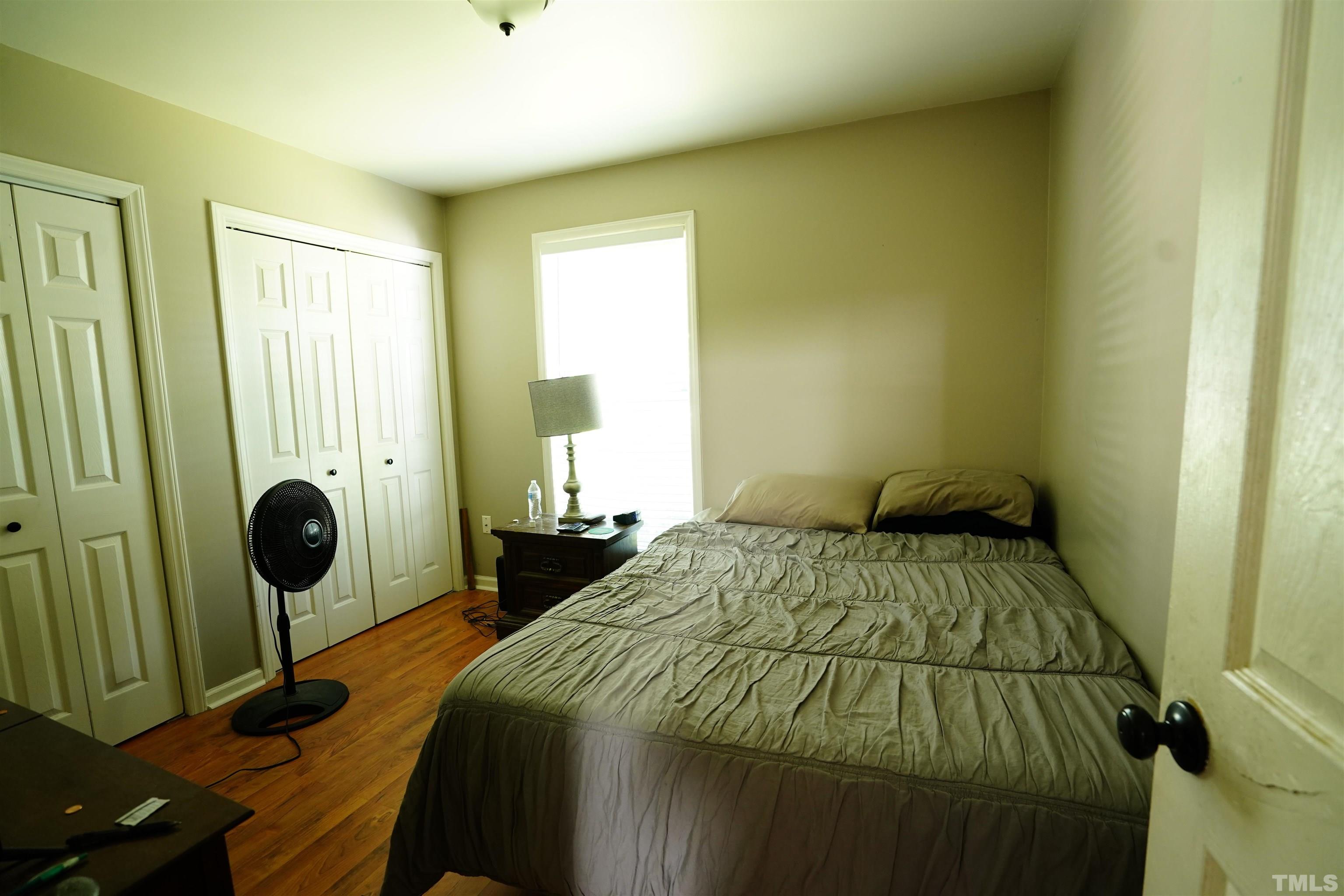 1212 Cranmoore Court Raleigh, NC 27604 - Photo 4 of 14 a bedroom with a bed and a table