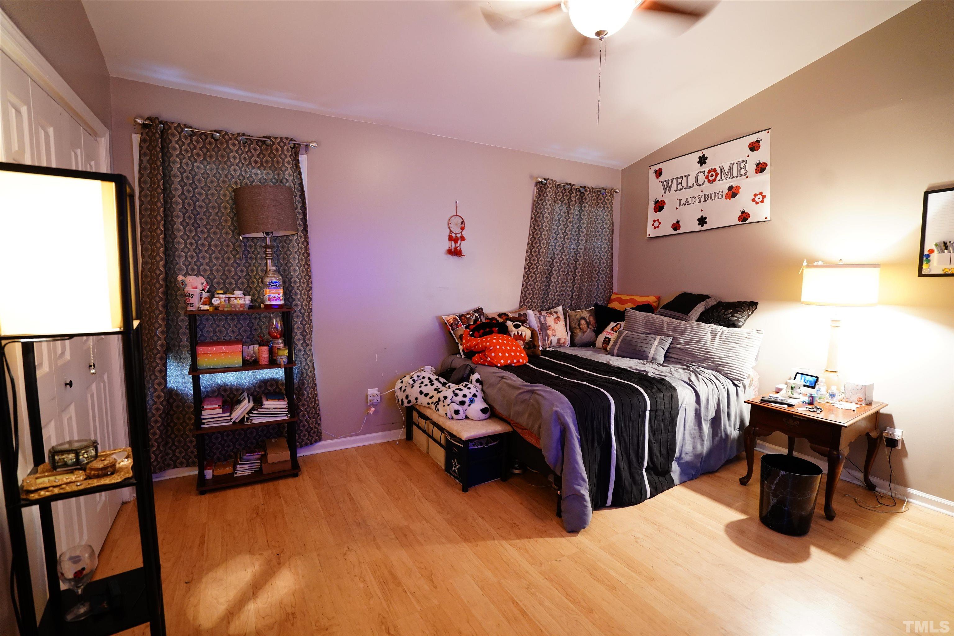 1212 Cranmoore Court Raleigh, NC 27604 - Photo 5 of 14 a bedroom with bed and window