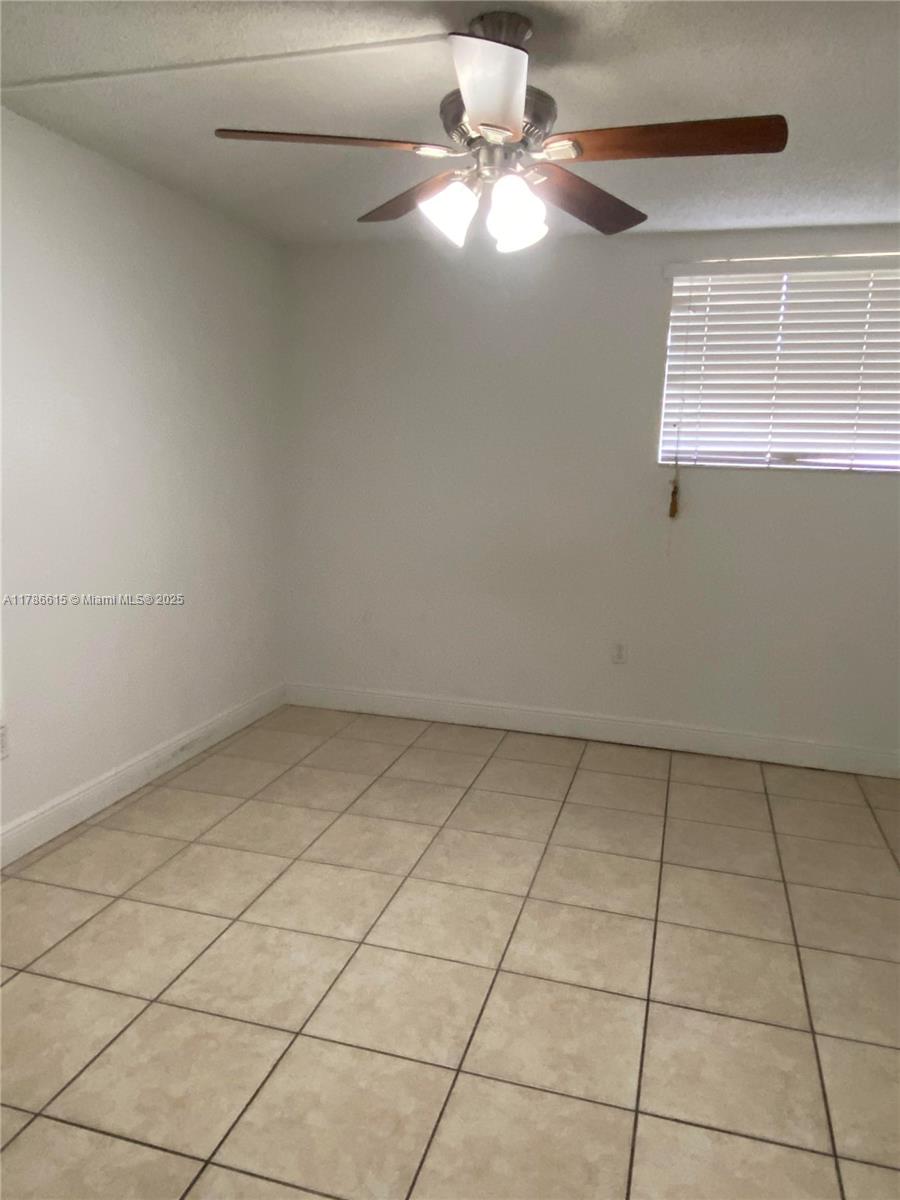 666 West 81st Street, Unit 127 Hialeah, FL 33014 - Photo 7 of 10 a view of an empty room with a window