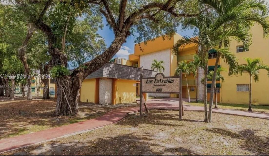 666 West 81st Street, Unit 127 Hialeah, FL 33014 - Photo 10 of 10 a front view of a house with a yard