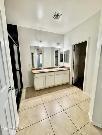 a kitchen with stainless steel appliances a refrigerator sink and microwave