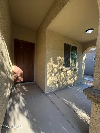 a view of an empty room and wooden floor