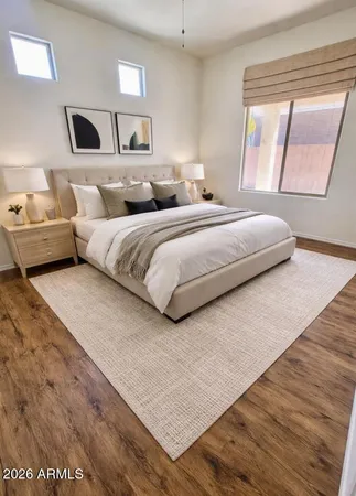 a bedroom with a bed and window