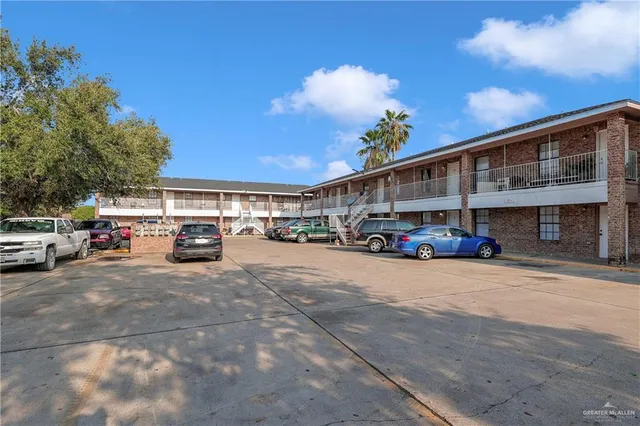 a view of a cars park in front of house