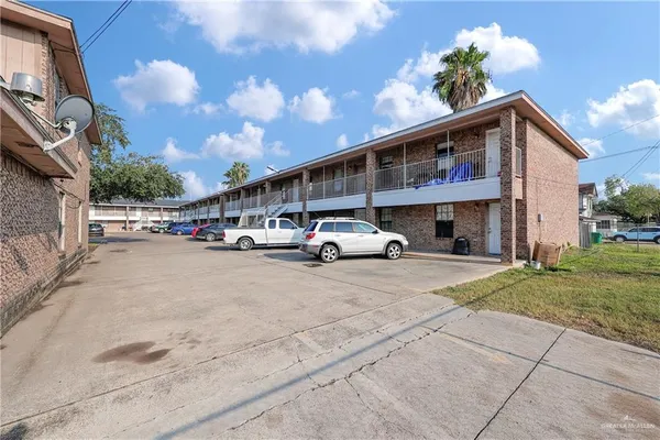 a view of building with car parked