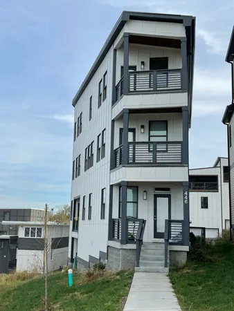 a view of a building with a yard