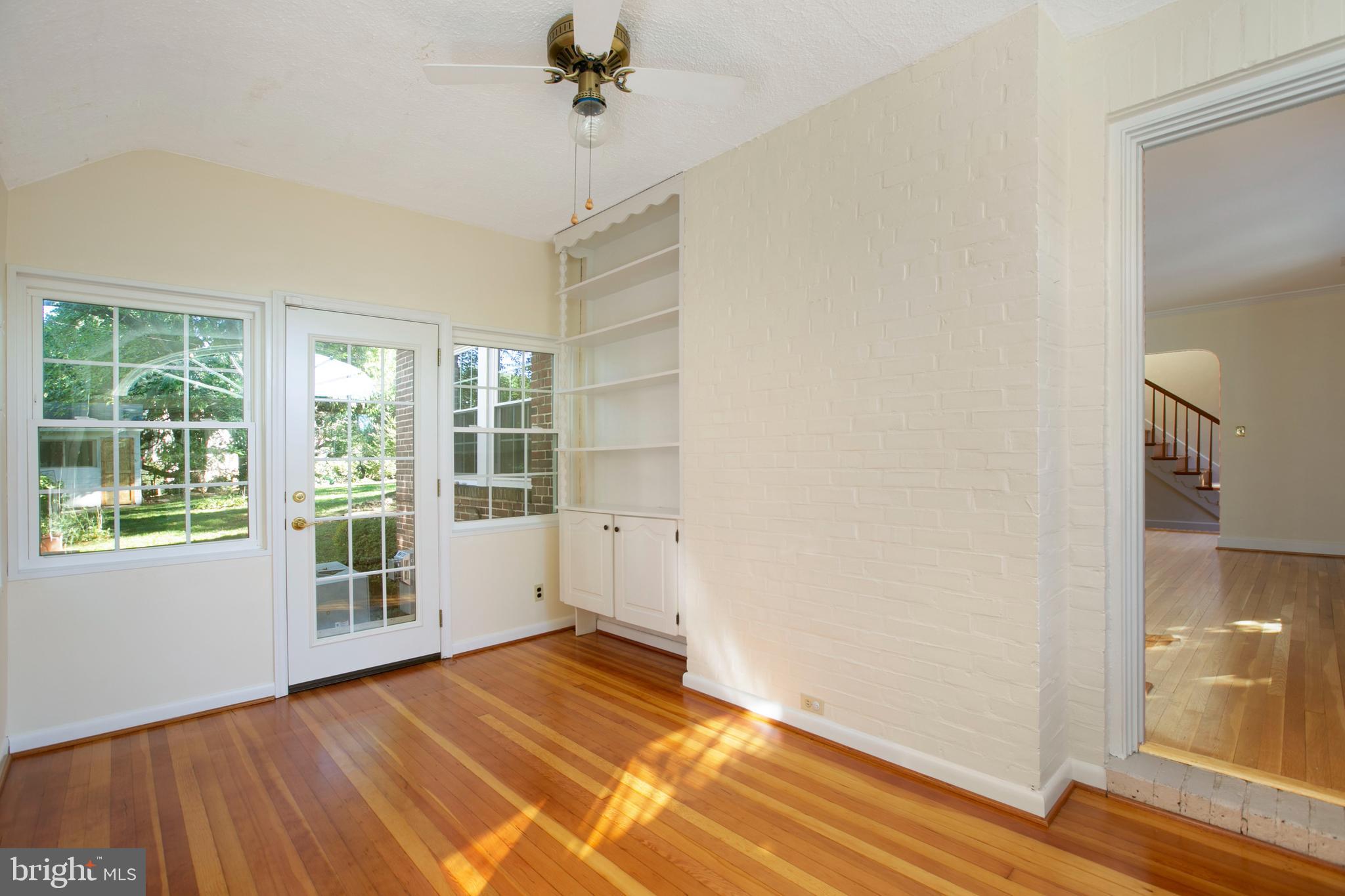 522 Overbrook Road Baltimore, MD 21212 - Photo 14 of 37 Built in cabinet, hardwood floors and ceiling fan.