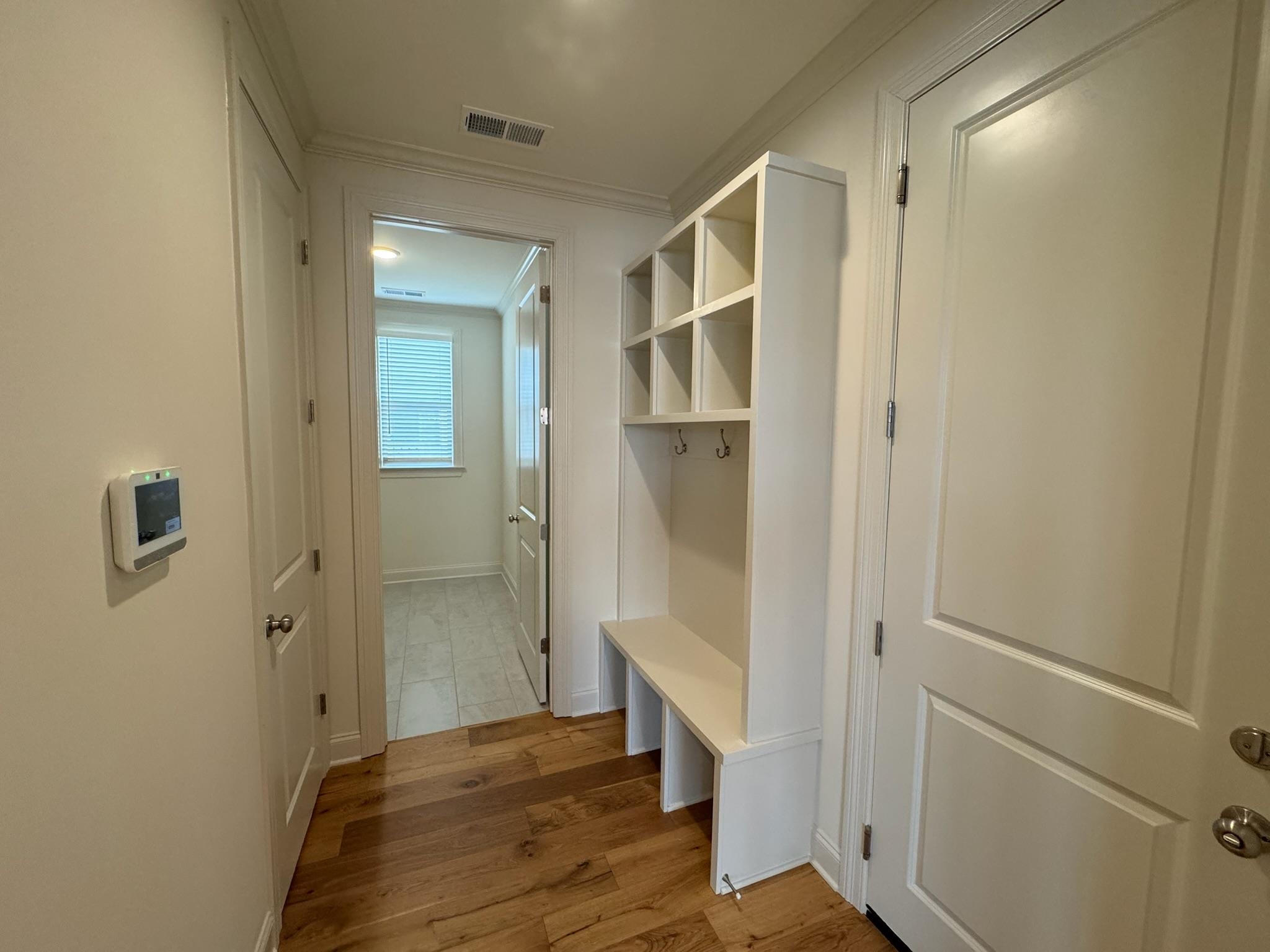 11512 Sunsparkler Way Collierville, TN 38017 - Photo 17 of 40 Mudroom with ornamental molding and light wood-style floors